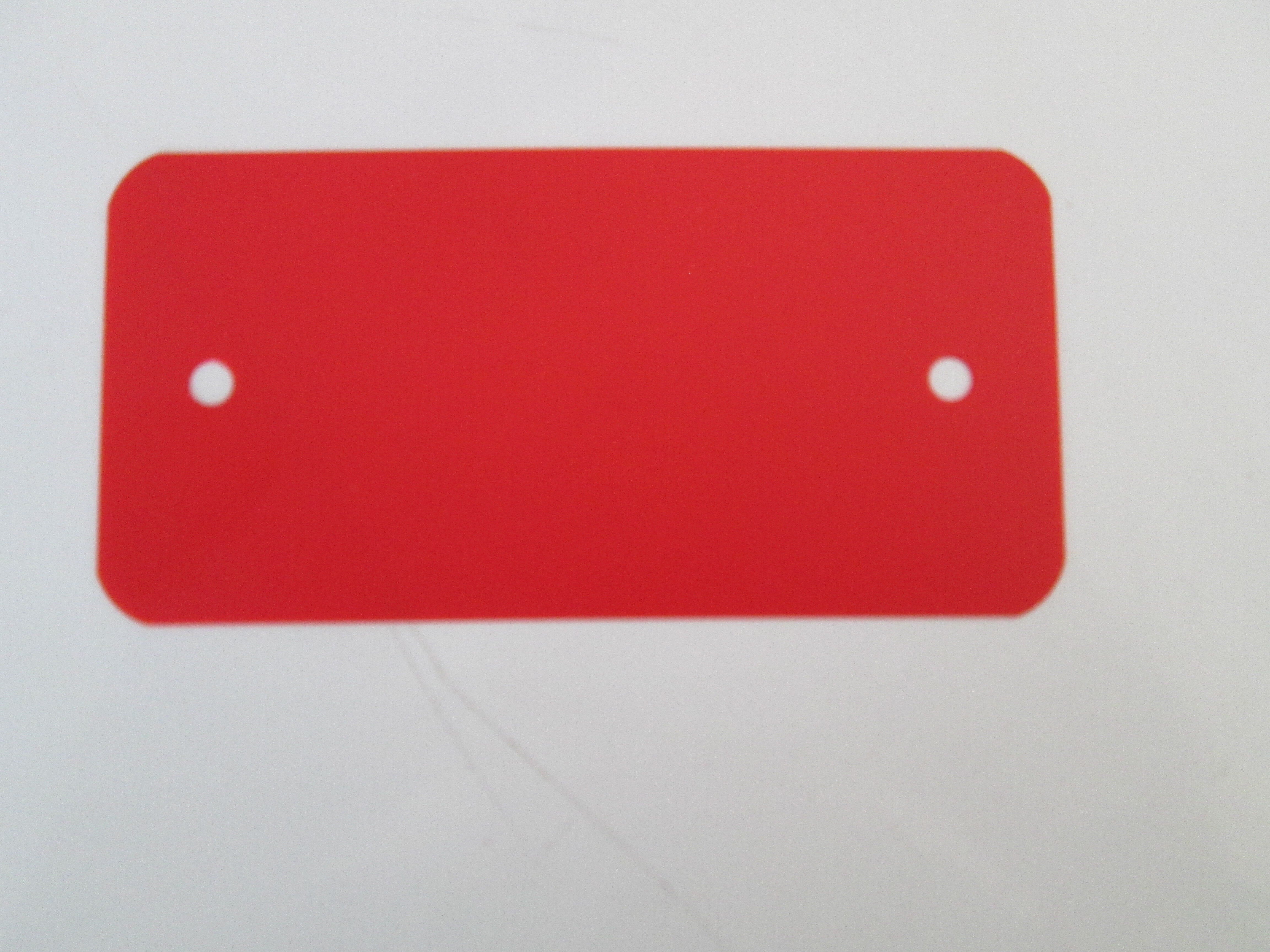Label kunststof rood     55x110x0.2